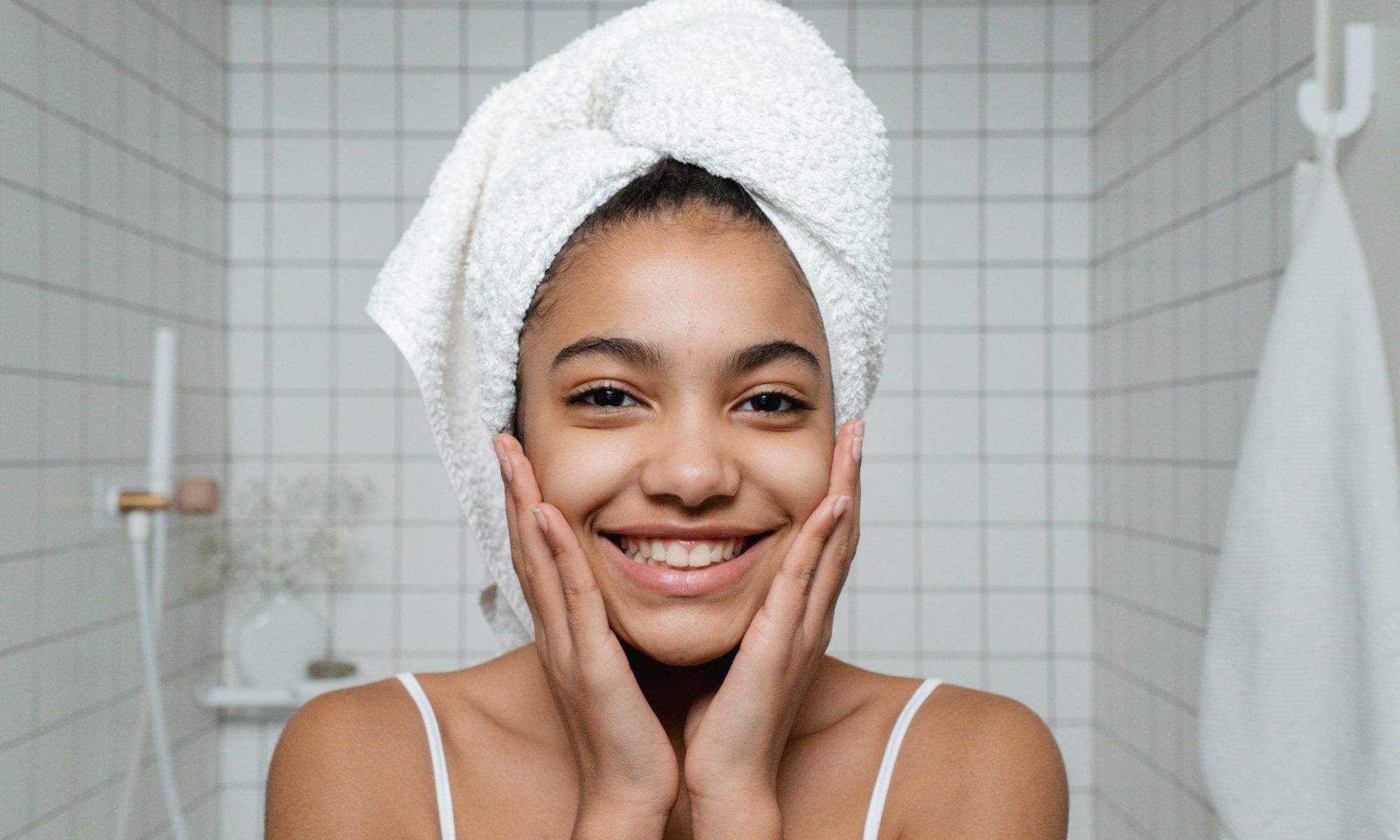 Women smiling and wearing a towel on her head
